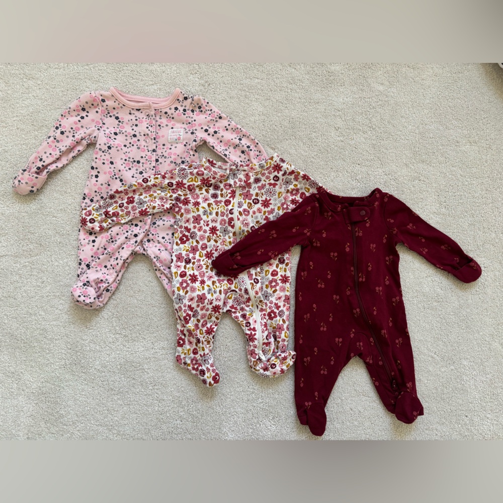 Three newborn sized sleepers.  Minimally worn.  Floral patterns.